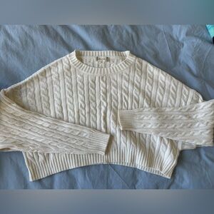 Cropped cable knit sweater